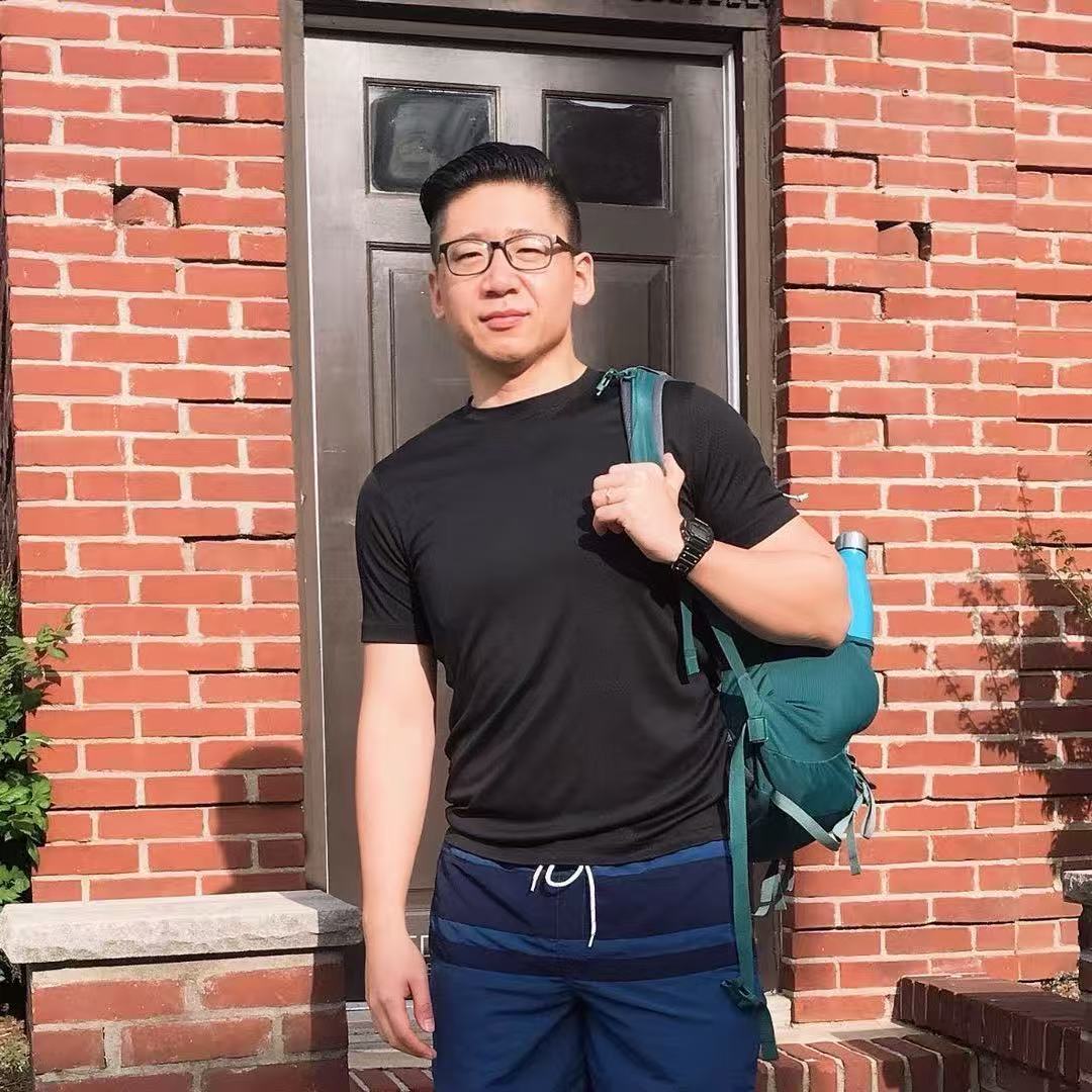 Zelun standing outside with a backpack
